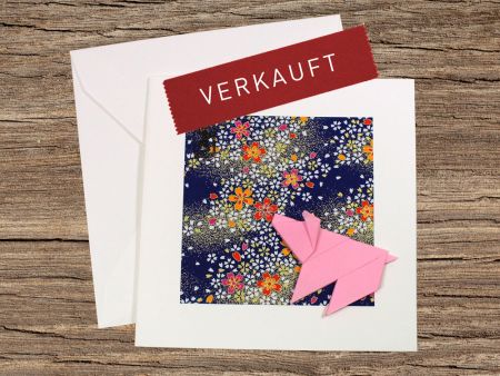 Origami-Schweinchen auf Washi mit Blumen